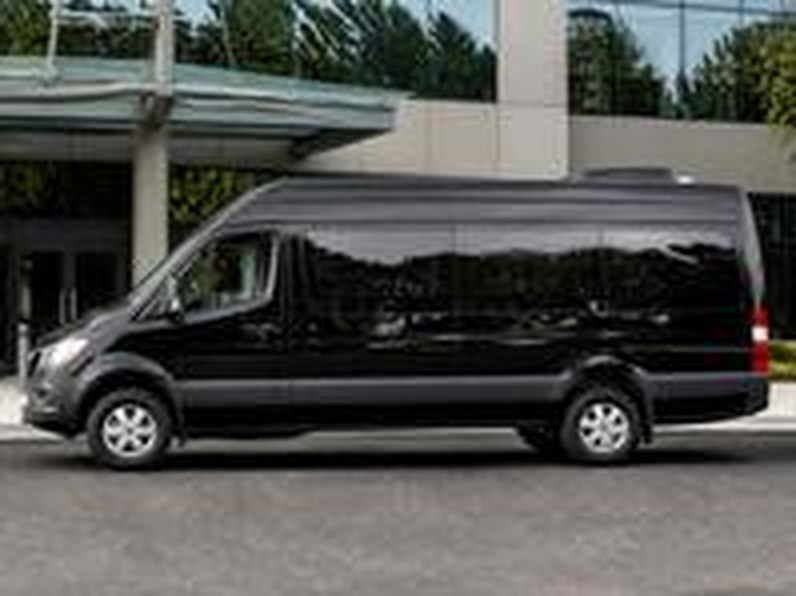 Black Sprinter van for group transportation